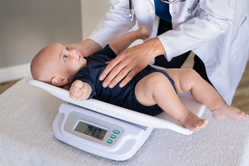doctor-weighing-baby-2025-01-07-23-37-48-utc.webp